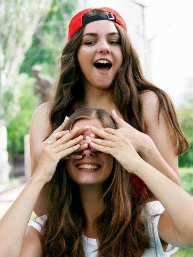 Two girls laughing and enjoying together.